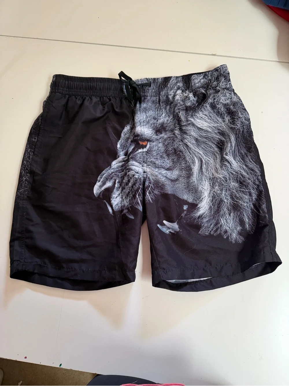 Black Men's Swim Board Shorts with Dramatic Lion Print